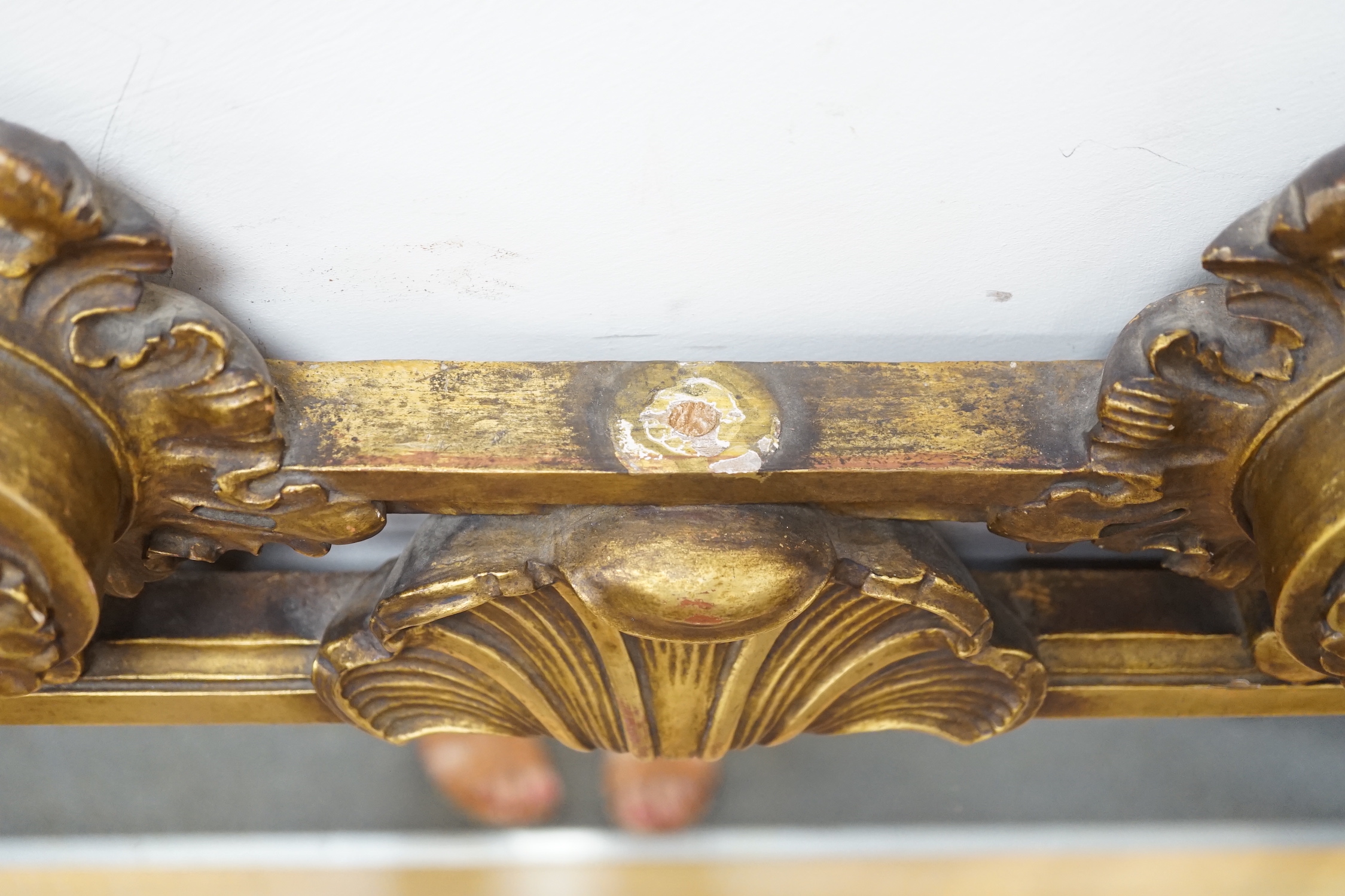 A rococo revival carved giltwood landscape mirror, width 160cm, height 113cm